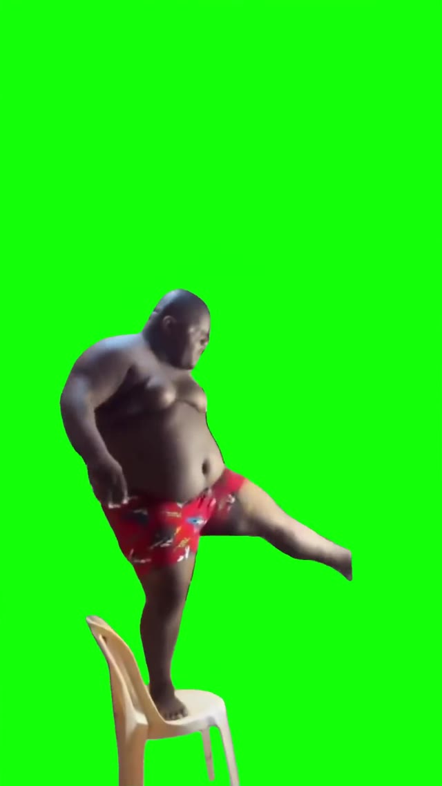 Guy dancing on a chair green screen