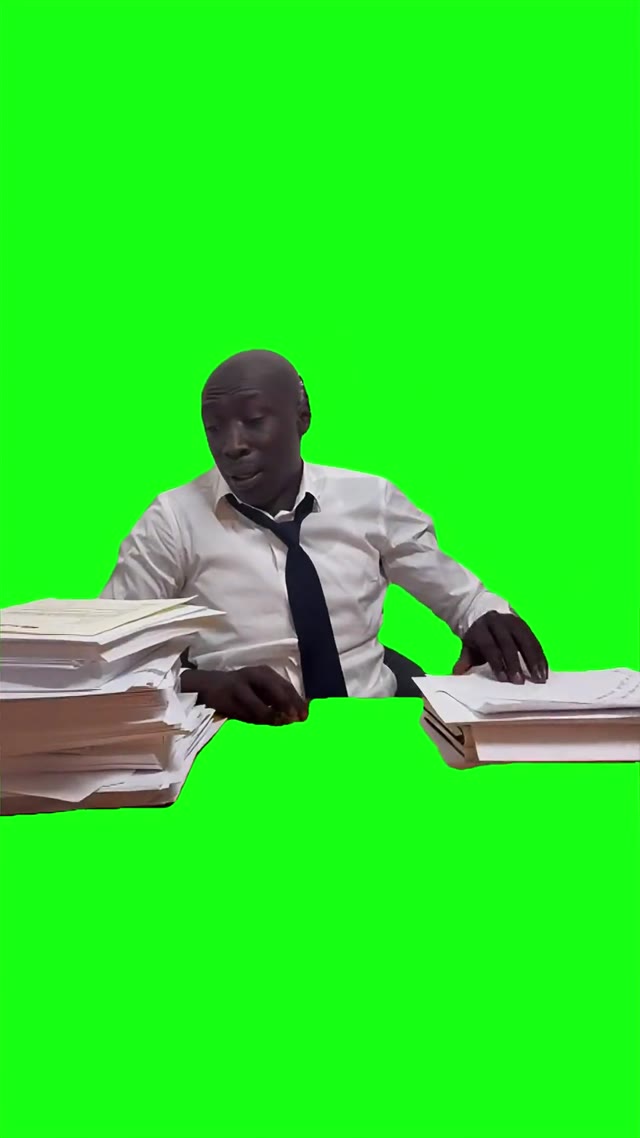 Khaby looking at stack of paper green screen