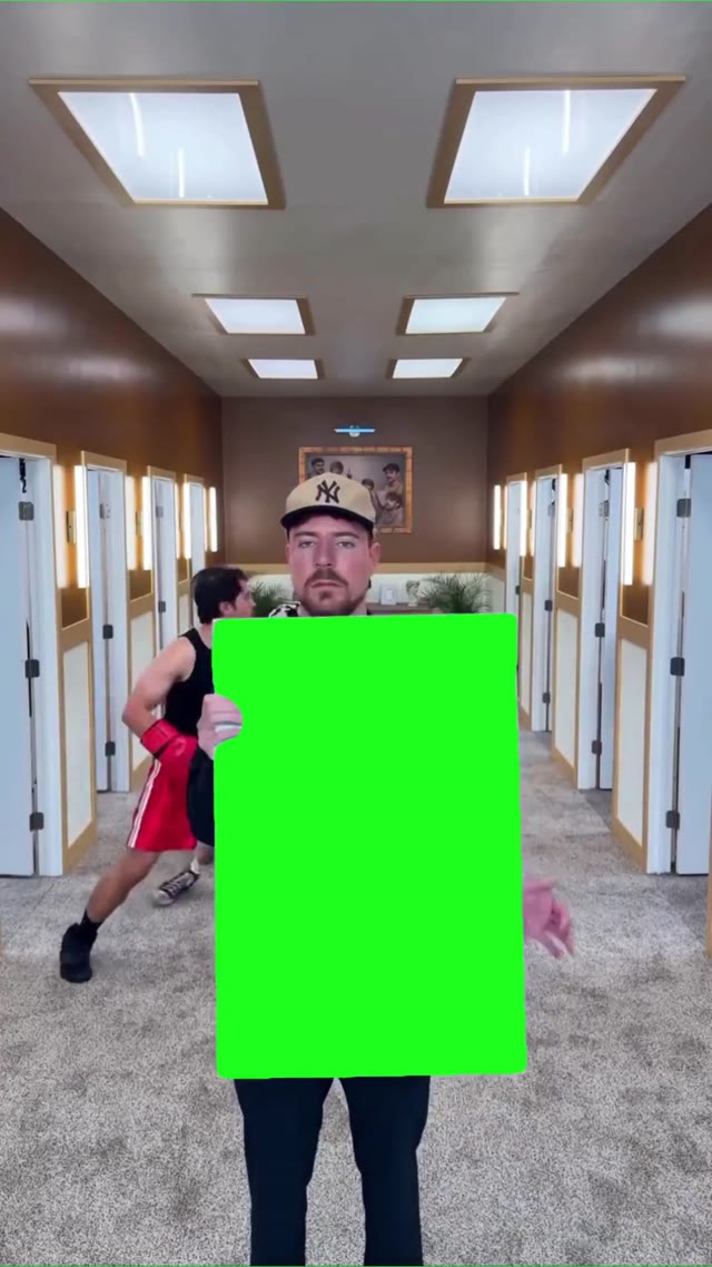 Mr beast holding a sign green screen