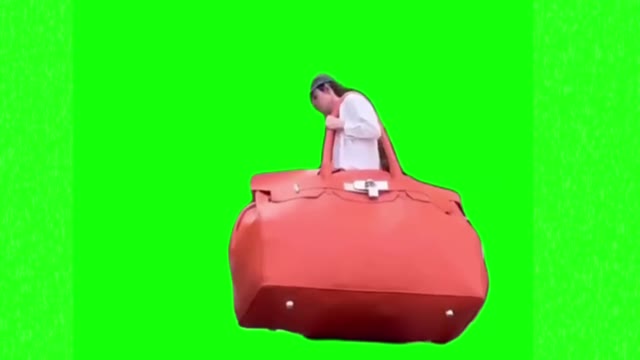 Walking with big purse green screen